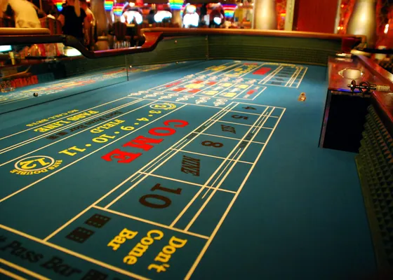 A craps layout with the pass line and the come box marked out.