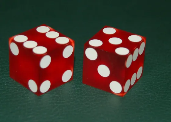 Two dice come to rest after a roll.