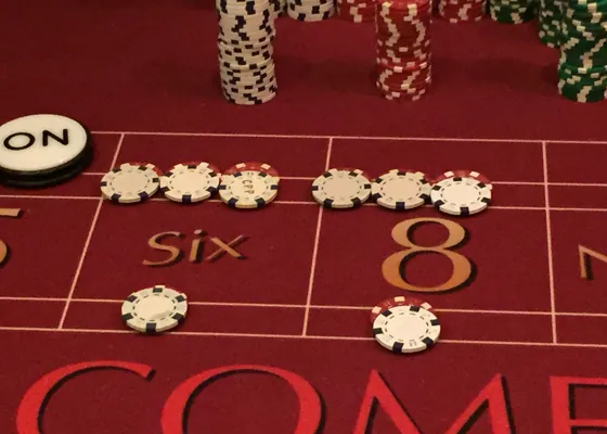 Chips and cards laid out on the felt at a casino night.