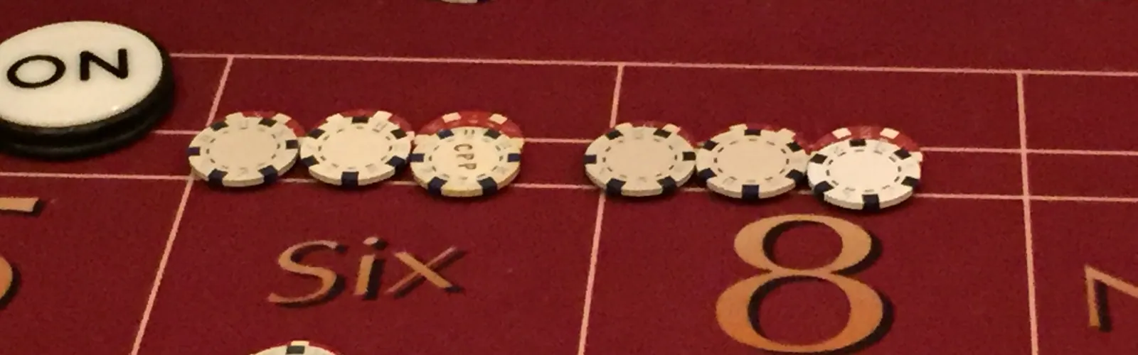 Casino chips and cards on the felt of a table game